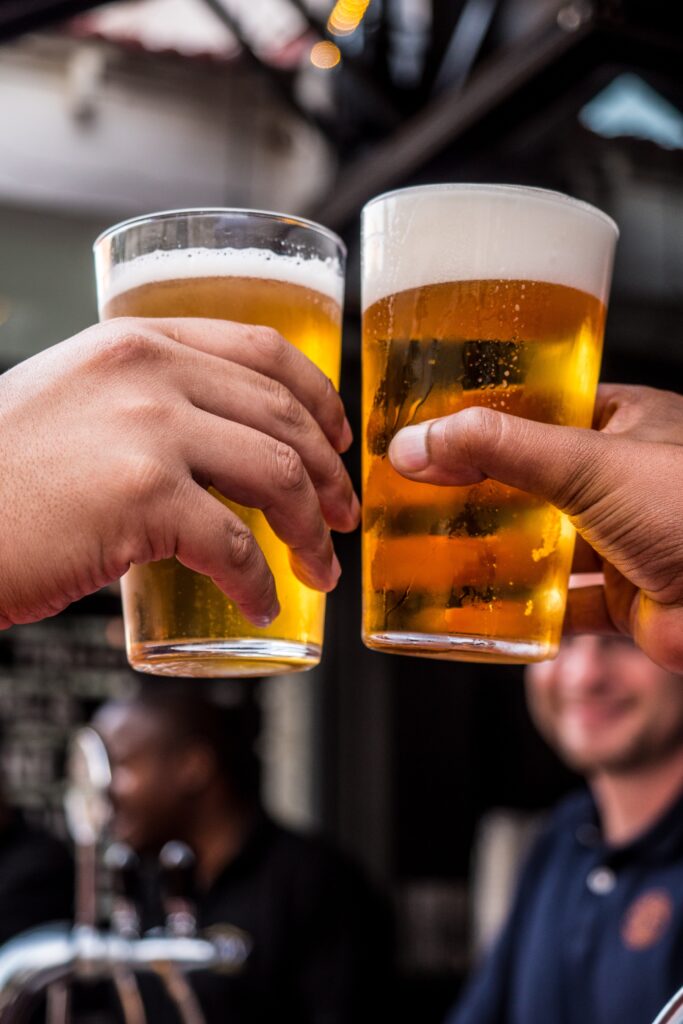 Cheers with French beers in a bar